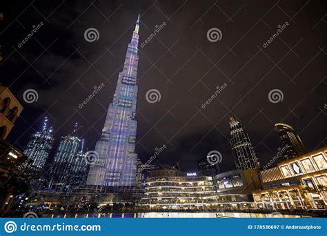 Burj Khalifa Skyscraper Illuminated With Colors And Dubai Mall At Night