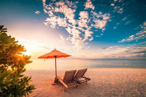 Beautiful Beach Sunset With Sun Beds And Relaxing Mood Stock Photo