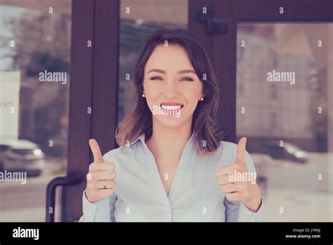 Happy Young Woman Giving Thumbs Up Gesture Standing Outside New