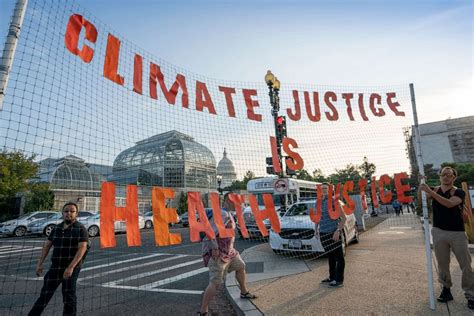 Here are some of the most powerful photos from the march. Climate change activists shut down streets in Washington, D.C. - ABC News