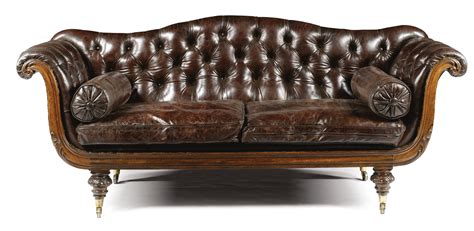 An Early Victorian Carved Mahogany And Leather Upholstered Sofa Circa