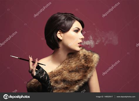 Women Smoking Cigarettes With Holders