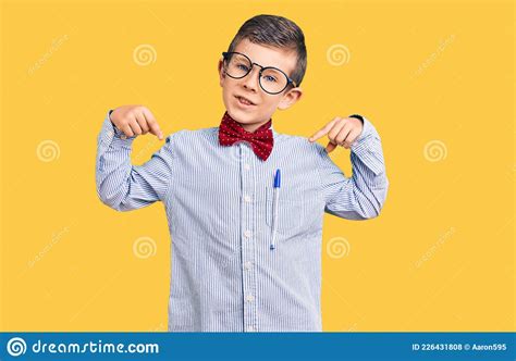 Cute Blond Kid Wearing Nerd Bow Tie And Glasses Looking Confident With
