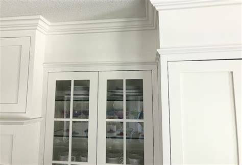 I thought i'd show you how we extended the cabinets to the ceiling to elongate the room a little bit. How to Fill Space between Cabinets and Ceiling | Caroline ...