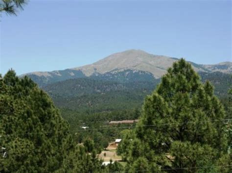The cabins are nestled amongst the pines with the resort adjoining national forest service land and the woodland lake trail system. River Deck - Picture of Whispering Pine Cabins, Ruidoso ...