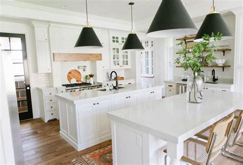Carrara - PentalQuartz If you have a kitchen with white storage cabinets, consider adding color back splash walls to liven up and add style to your home.