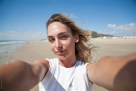 Selfie Of A Beautiful Blonde Woman Walking On The Beach Del