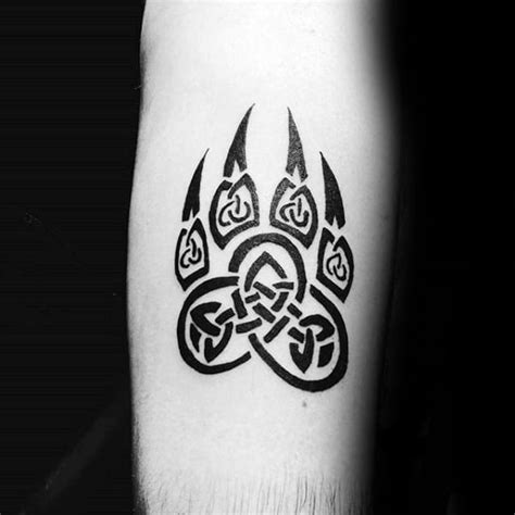 Okay here is an awesome design where the tattoo artist also showed the face of the dog. 50 Wolf Paw Tattoo Designs For Men - Animal Ink Ideas