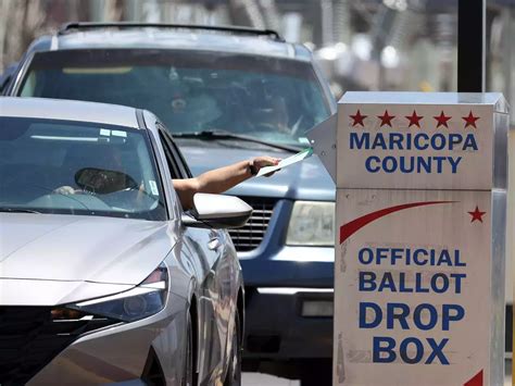 Armed And Masked Ballot Watchers Sat By A Ballot Drop Box In Arizona Prompting Police