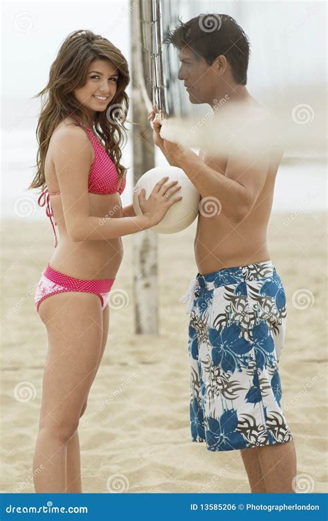 Couple Flirting On Beach With Volleyball Royalty Free Stock Image Image