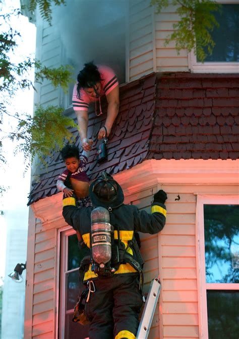 Video Emotional Reunion Between Firefighter And Rescued Mom And Child