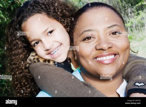 African Mother And Daughter Hugging Outdoors Stock Photo Alamy