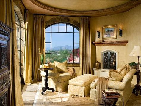 The terms master suite and master bedroom are used frequently in the design world. sitting area in a master bedroom with a fireplace and a ...