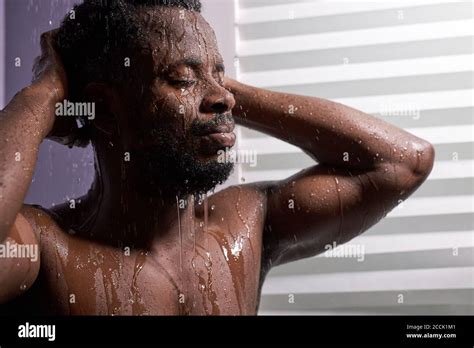 Handsome Dark Skineed Man Taking Shower In Bathroom Relaxed Man Enjoy