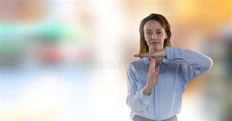 Businesswoman Calling Time Out With Blur Background Stock Image Image