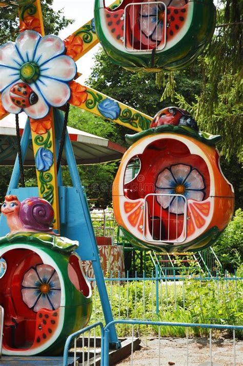 Amusement In A Children`s Park Swings Carousels On The Background Of