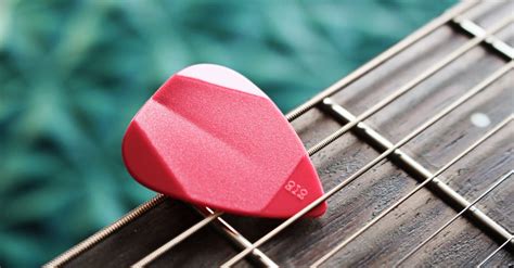 Close Up Photo Of Red Guitar Pick · Free Stock Photo