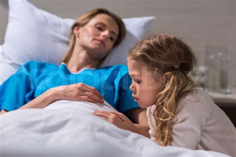 Daughter Spending Time With Sick Mother At Hospital Stock Image
