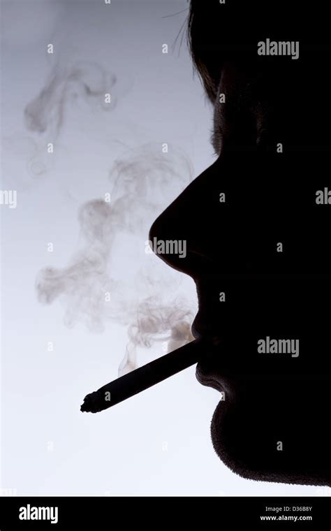 Close Up Silhouette Of Smoking Man Stock Photo Alamy