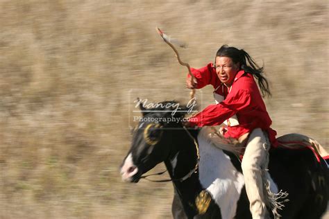 A Native American Sioux Indian Man Riding Horseback On A Indian Horse