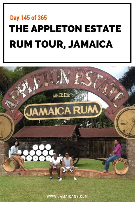people sitting on benches in front of the sign for jamaica rum