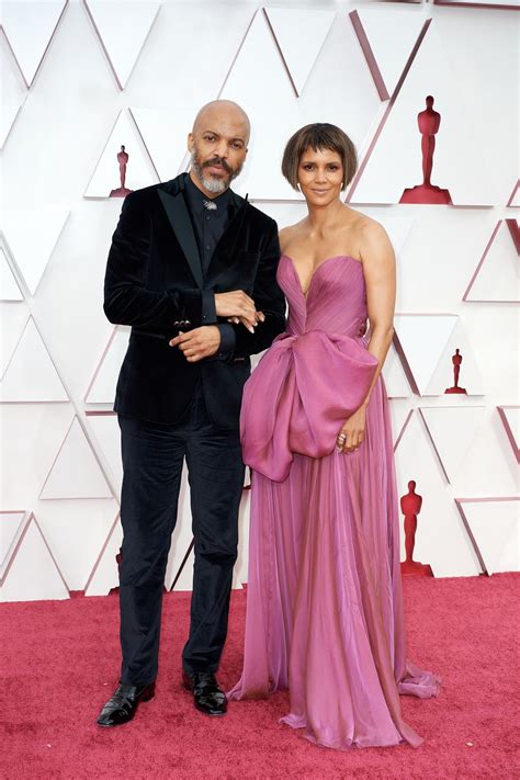 Halle Berry Sexy Shows Off Her Cleavage Wearing A Purple Gown At The