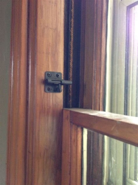 Open the window to its widest point. On our first floor we installed 2 inch door latches on the ...