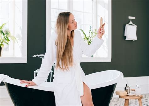 Free Photo Blonde Girl Posing In The Bathroom With Bath Robe