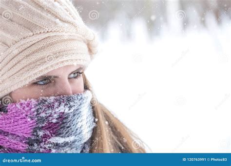 Winter Portrait Of Beautiful Blond Woman With Scarf Over Nose And Mouth To Protect From The