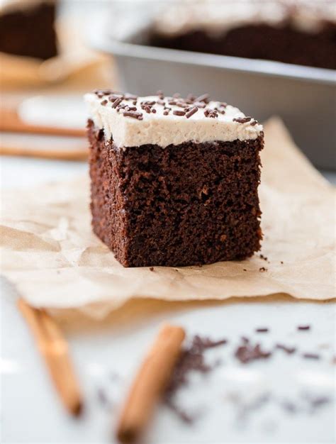 A Small Square Slice Of Mexican Chocolate Cake With Cinnamon Frosting