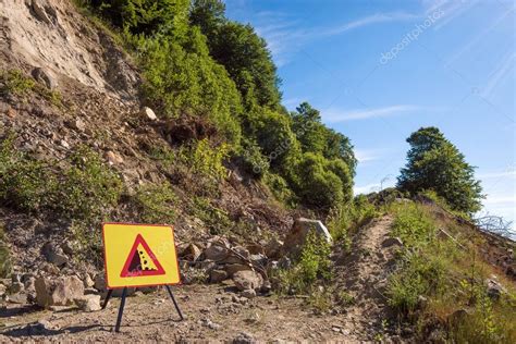 Landslide In Forest Dirt Road And Warning Sign — Stock Photo