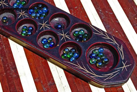 Streams of protons and electrons from the sun (.) Congkak is a mancala game of Malay origin played in ...