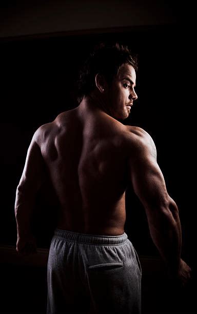 Stunning Muscular Young Men Bodybuilder Looking Behind Stock Photos