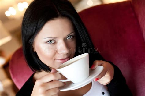 Young Woman Sitting In A Cafe Drinking Coffee Stock Photo Image Of