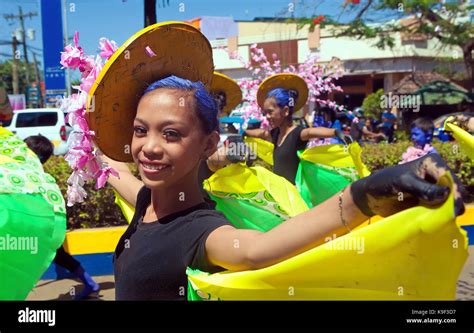 Costumed Filipino Teenage Girls March In The Annual Parade Celebrating