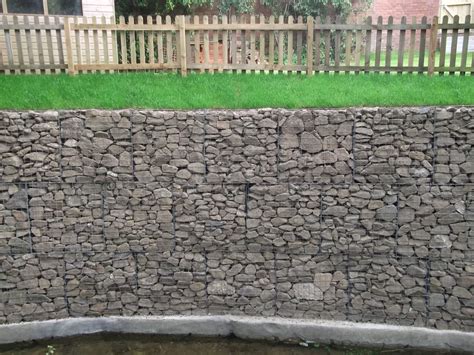 The gabion wall collects this debris for about 50 years before the wire cages break down. Gabion Retaining Wall - James Lockyer Associates - Civil & Structural Engineers