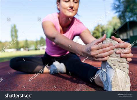 Female Athlete Exercise Stadiumstretching Groin Stock Photo 1845289333