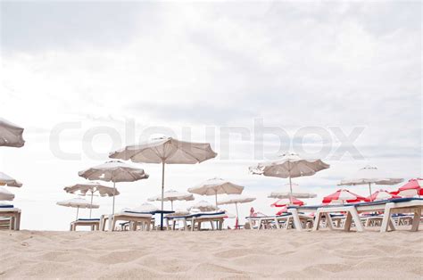 Lounge Chairs And Umbrellas On The Beach Stock Image Colourbox