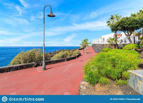 Coastal Promenade With Tropical Plants In San Juan Seaside Town