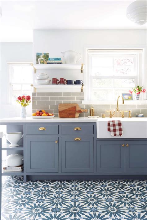 An extra shelf can be handy for all cupboards, but especially so for those used for tins and small jars where it can be difficult to see everything you have at once. Modern Deco Kitchen Reveal - Emily Henderson