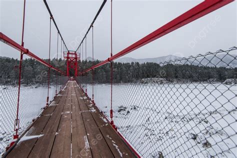 Suspension Hanging Bridge Above Winter Frozen Mountain Katun River