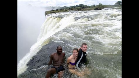 Hanging Over The Edge Of Victoria Falls From The Devils Pool