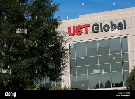 A Logo Sign Outside Of The Headquarters Of Ust Global In Aliso Viejo