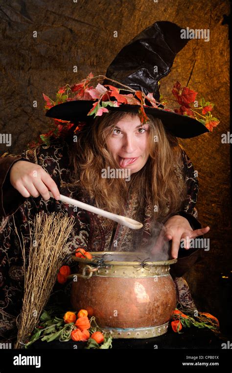 Halloween Witch Cooking In A Copper Making Faces Stock Photo Alamy