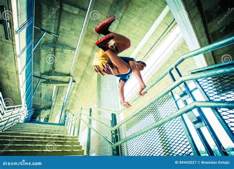 Young Man Practice Parkour Jump In The City Stock Image Image Of