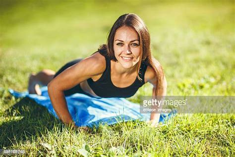 Woman Doing Pushups On Grass Photos And Premium High Res Pictures