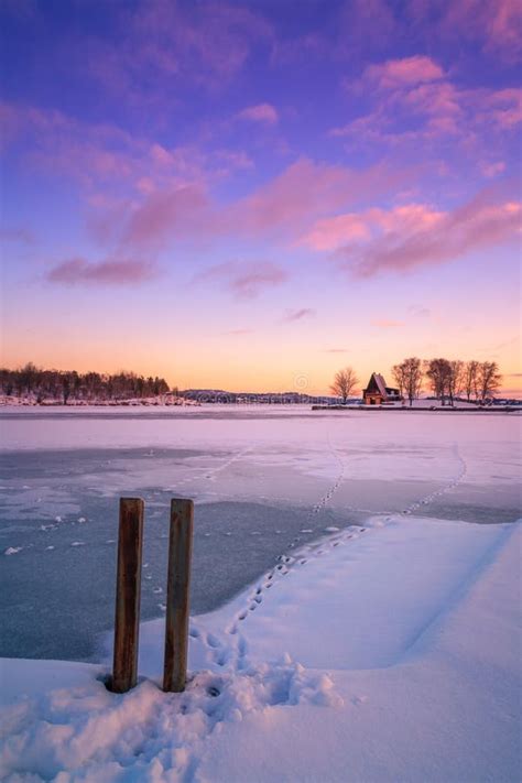 View Of A Frozen Lake During Sunrise In Winter Season Stock Image