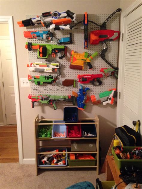 The gun holders are acoustic foam tiles, cut to fit and the shelves source: 24 Ideas for Diy Nerf Gun Rack - Home, Family, Style and ...