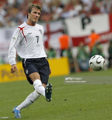 English Midfielder David Beckham Passes The Ball During His Teams