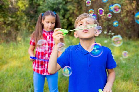 Kids Playing With Bubbles Stock Image Image Of Childhood 105187883